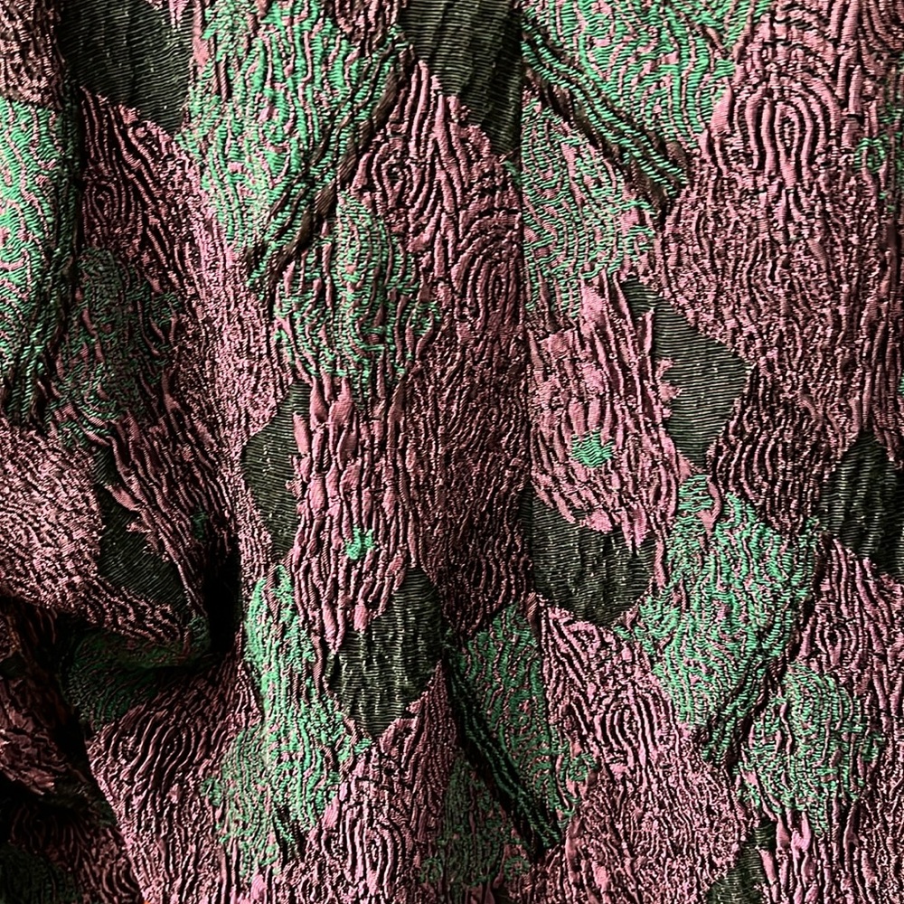 Skirt waistband is elastic colors purple &green. Skirt is below the knee midi - Picture 6 of 7